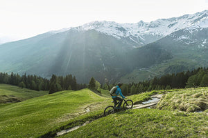 Electric bike being ridden outside by a mountain